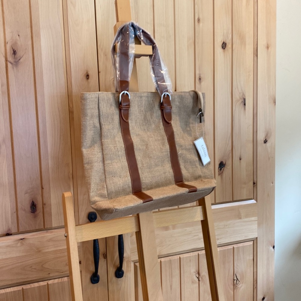Taleen burlap tote bag with belted vinyl straps.